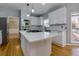 Updated kitchen boasts stainless appliances, a large island, and sleek finishes at 2001 Towne Lake W Hls, Woodstock, GA 30189