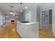 Kitchen island overlooking the living area with fireplace and built-in shelving at 2001 Towne Lake W Hls, Woodstock, GA 30189