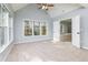 Large carpeted main bedroom with lots of natural light and a view of ensuite at 2001 Towne Lake W Hls, Woodstock, GA 30189