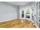 Office space showcasing hardwood floors, natural light, and French doors at 2001 Towne Lake W Hls, Woodstock, GA 30189