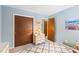 Bright bedroom featuring light blue walls, white trim, and neutral carpet at 607 Cascade Sw Dr, Lilburn, GA 30047