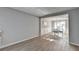 Light-filled living room showcasing open layout to dining area at 1171 Pine Acre Dr, Sugar Hill, GA 30518