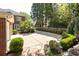 Brick house featuring landscaped backyard with stone patio at 3448 Paces Ferry Cir, Smyrna, GA 30080