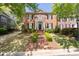 Classic red brick two-story home with black shutters and manicured front lawn at 3448 Paces Ferry Cir, Smyrna, GA 30080