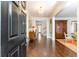 Long Foyer with dark wood flooring and a view into other rooms at 3448 Paces Ferry Cir, Smyrna, GA 30080