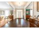 Inviting foyer with dark wood floors and an elegant chandelier at 3448 Paces Ferry Cir, Smyrna, GA 30080