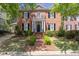 Charming brick home featuring a manicured front yard, brick steps, and black shutters at 3448 Paces Ferry Cir, Smyrna, GA 30080