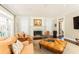 A lovely living room featuring a ceiling fan, a traditional fireplace, lots of natural light, and comfortable seating at 3448 Paces Ferry Cir, Smyrna, GA 30080