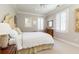 Inviting main bedroom featuring a bed with white bedding and neutral decor at 3448 Paces Ferry Cir, Smyrna, GA 30080