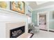 Main bedroom fireplace and entry to bathroom featuring a soaking tub and dual sink vanity at 3448 Paces Ferry Cir, Smyrna, GA 30080