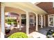 Covered brick patio featuring elegant white columns and seating at 3448 Paces Ferry Cir, Smyrna, GA 30080