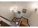 Top-down view of the staircase showing hardwood floors, light fixtures, and neutral walls at 3448 Paces Ferry Cir, Smyrna, GA 30080