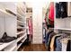 Bright walk-in closet featuring organized storage with shelves and hanging racks at 3448 Paces Ferry Cir, Smyrna, GA 30080