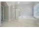 Bathroom showcasing a large soaking tub and a separate glass-enclosed shower at 3502 Crown Peak Ct, Suwanee, GA 30024