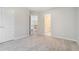 Bright, carpeted bedroom with white trim, adjacent to bath and hallway at 3502 Crown Peak Ct, Suwanee, GA 30024