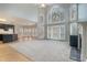 Bright living room featuring soaring ceilings, large windows, and elegant fireplace at 3502 Crown Peak Ct, Suwanee, GA 30024