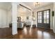 Welcoming foyer with hardwood floors, elegant lighting, and a view into the living room at 4325 Cody Ct, Cumming, GA 30040