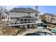 An elevated view of the back of the house with a screened-in porch, pool, and patio area at 4325 Cody Ct, Cumming, GA 30040