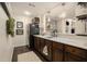 Kitchenette features dark wood cabinets, marble countertops, and a stainless steel refrigerator at 4325 Cody Ct, Cumming, GA 30040