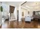 Hardwood foyer featuring a staircase and view into the living room at 4325 Cody Ct, Cumming, GA 30040