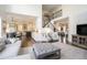 Open-concept living room with a view into a white kitchen and stairway at 4325 Cody Ct, Cumming, GA 30040