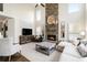 Spacious living room featuring a stone fireplace and high ceilings at 4325 Cody Ct, Cumming, GA 30040