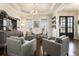 Bright living room showcasing a modern light fixture and hardwood floors at 4325 Cody Ct, Cumming, GA 30040