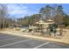 Image of a community playground with climbing structures, slides, and covered picnic areas at 4325 Cody Ct, Cumming, GA 30040