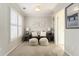 Cozy sitting room with neutral tones, plush seating, and natural light from the window at 4325 Cody Ct, Cumming, GA 30040