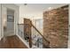 Stairway with decorative stone wall feature and dark metal railing at 4325 Cody Ct, Cumming, GA 30040