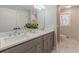 Contemporary bathroom with double sinks, quartz countertop, and modern fixtures at 442 Mountain Park Trl, Stone Mountain, GA 30087