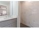 Modern bathroom showcasing a stylish vanity, sleek fixtures, and tiled walk-in shower at 442 Mountain Park Trl, Stone Mountain, GA 30087