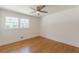 Bedroom with hardwood floors and large windows with exterior views at 442 Mountain Park Trl, Stone Mountain, GA 30087