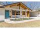 Stunning home with an eye-catching turquoise front door, wooden columns, and an open carport at 442 Mountain Park Trl, Stone Mountain, GA 30087