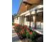 Updated home showing fresh landscaping with colorful flowers and wooden column accents on the covered front porch at 442 Mountain Park Trl, Stone Mountain, GA 30087