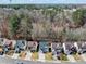 Aerial view of a suburban neighborhood with tree lined streets and manicured lawns at 900 Melrose Park Pl, Lawrenceville, GA 30044