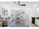 Bright living room with modern furnishings, ceiling fan, and natural light at 900 Melrose Park Pl, Lawrenceville, GA 30044