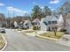 Street view of a suburban neighborhood with well-maintained homes and landscaping at 900 Melrose Park Pl, Lawrenceville, GA 30044