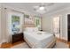 Comfortable bedroom featuring neutral decor, ceiling fan and views of the backyard at 1272 Oakdale Ne Rd, Atlanta, GA 30307