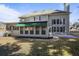 Charming home featuring a covered patio area with several windows and ample backyard space at 1278 Crown Ter, Marietta, GA 30062