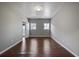 Spacious bedroom with hardwood floors, neutral paint, and natural light from two large windows at 1278 Crown Ter, Marietta, GA 30062
