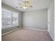 Bright bedroom featuring a ceiling fan, neutral walls, plush carpet, and large windows with natural light at 1278 Crown Ter, Marietta, GA 30062