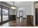 Elegant dining space featuring hardwood floors, wainscoting, and an archway at 1278 Crown Ter, Marietta, GA 30062