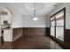 Cozy dining room with hardwood floors, wainscoting, and a modern light fixture at 1278 Crown Ter, Marietta, GA 30062