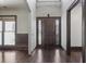 Elegant front entryway featuring a wooden door with glass panels and dark wood flooring at 1278 Crown Ter, Marietta, GA 30062