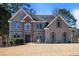 Charming two-story home showcasing a well-manicured lawn and welcoming front entrance at 1278 Crown Ter, Marietta, GA 30062
