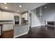 Open-concept living space featuring a modern kitchen, fireplace, and hardwood floors at 1278 Crown Ter, Marietta, GA 30062