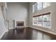 Bright living room with a stone fireplace, large windows, and hardwood floors at 1278 Crown Ter, Marietta, GA 30062