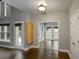 Bright living area with hardwood floors, ample windows, and view to adjacent sunroom at 1278 Crown Ter, Marietta, GA 30062