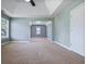 Spacious carpeted primary bedroom with neutral paint, two windows, a tray ceiling, and white baseboards at 1278 Crown Ter, Marietta, GA 30062